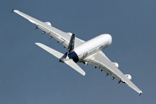 Fototapeta Biały samolot na niebie 